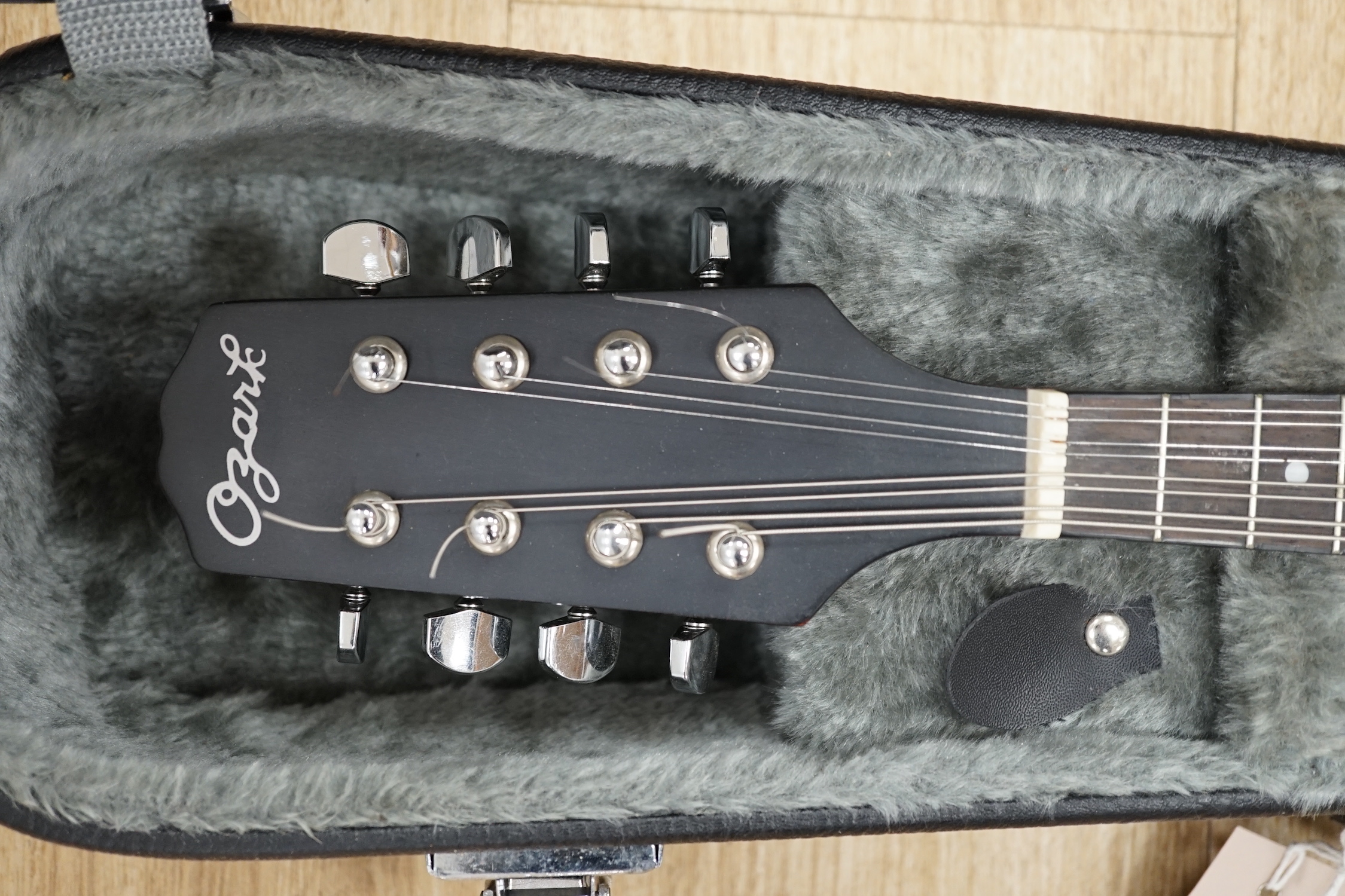 A cased 'Army and Navy' model Ozark mandolin, body length 29cm, in a good hard case